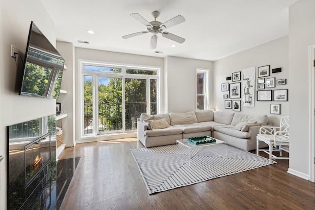1730 W Diversey Pkwy Unit 2E, Chicago, IL 60614 - living room featuring a high end fireplace, wood finished floors, ceiling fan, baseboards, and recessed lighting