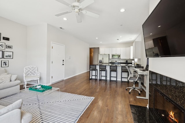 1730 W Diversey Pkwy Unit 2E, Chicago, IL 60614 - living area featuring dark wood-type flooring, ceiling fan, recessed lighting, baseboards, and a fireplace