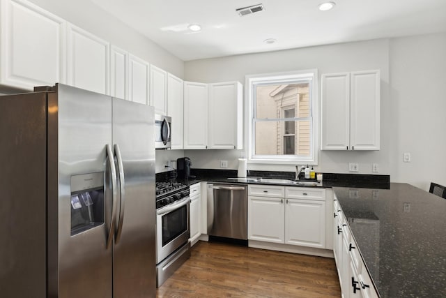 1730 W Diversey Pkwy Unit 2E, Chicago, IL 60614 - kitchen with stainless steel appliances, a sink, white cabinetry, recessed lighting, and dark wood-type flooring