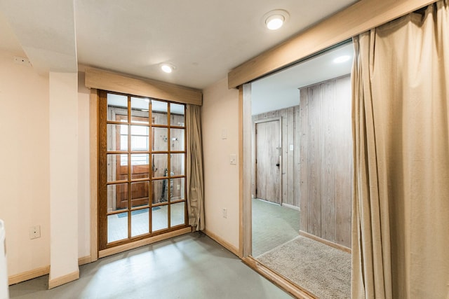 707 Coolidge Pl, Rockford, IL 61107 - unfurnished room featuring concrete floors, baseboards, and radiator