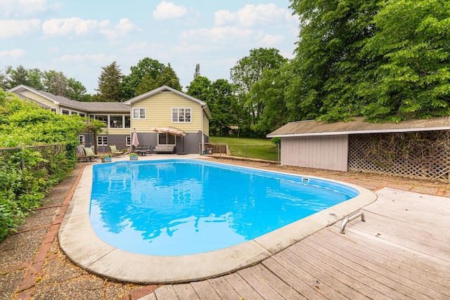 707 Coolidge Pl, Rockford, IL 61107 - view of pool with a wooden deck and view of wooded area