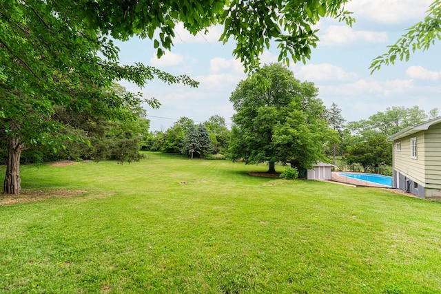 707 Coolidge Pl, Rockford, IL 61107 - view of grassy yard with an outdoor pool