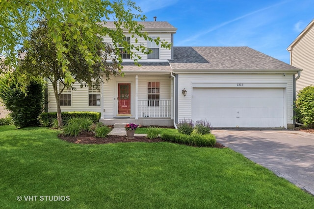 1313 Edington Ln, Mundelein, IL 60060 - view of front of house with covered porch, concrete driveway, a front yard, a shingled roof, and an attached garage
