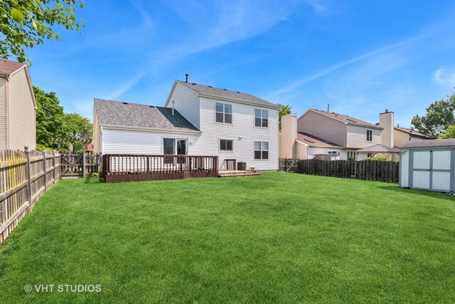 1313 Edington Ln, Mundelein, IL 60060 - rear view of house with a shed, a fenced backyard, a deck, and roof with shingles