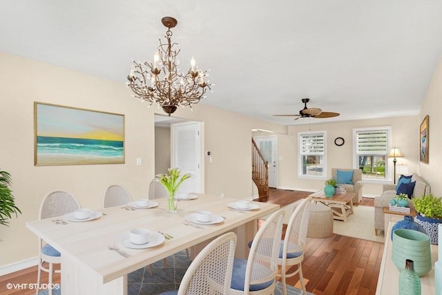 1313 Edington Ln, Mundelein, IL 60060 - dining room featuring wood finished floors, stairway, ceiling fan, and a chandelier