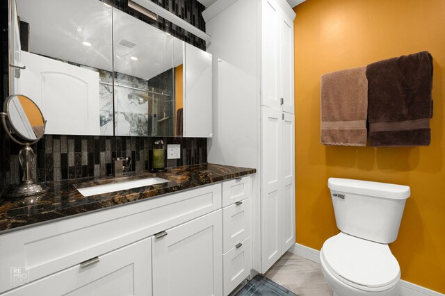 12732 S Austin Ave, Palos Heights, IL 60463 - bathroom featuring backsplash, a stall shower, vanity, toilet, and baseboards