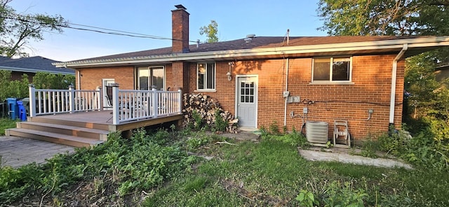 12732 S Austin Ave, Palos Heights, IL 60463 - rear view of property featuring brick siding, a chimney, a deck, and cooling unit