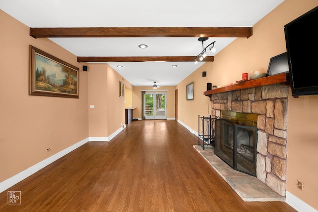 12732 S Austin Ave, Palos Heights, IL 60463 - unfurnished living room featuring a stone fireplace, wood finished floors, baseboards, a ceiling fan, and beamed ceiling