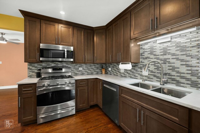 12732 S Austin Ave, Palos Heights, IL 60463 - kitchen with appliances with stainless steel finishes, a sink, tasteful backsplash, and light countertops