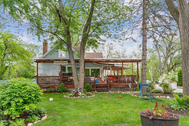 20425 N Hazelcrest Rd, Palatine, IL 60074 - back of property with a chimney, a wooden deck, and a lawn