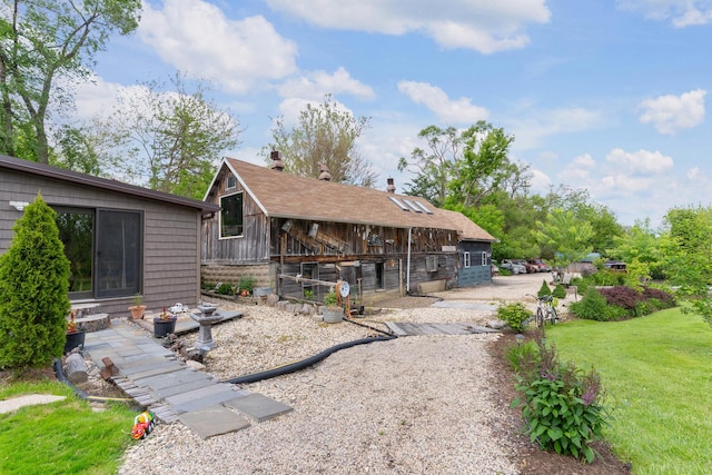 20425 N Hazelcrest Rd, Palatine, IL 60074 - back of property with exterior structure, an outbuilding, a chimney, and a yard