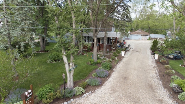 20425 N Hazelcrest Rd, Palatine, IL 60074 - view of front of house with a front lawn, an outdoor structure, driveway, and a detached garage
