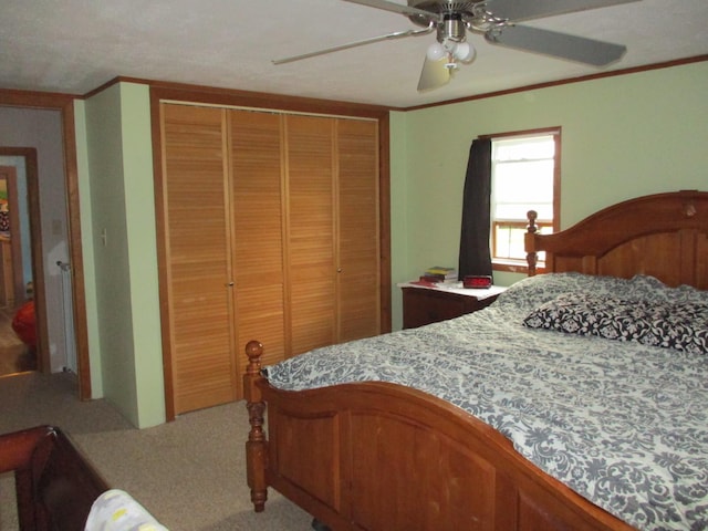 411 S Walnut St, Forreston, IL 61030 - carpeted bedroom with a closet, ornamental molding, and ceiling fan