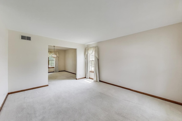 1492 Della Dr, Hoffman Estates, IL 60169 - unfurnished room featuring a chandelier and light colored carpet