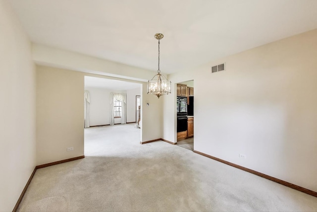 1492 Della Dr, Hoffman Estates, IL 60169 - unfurnished room featuring light colored carpet and a chandelier