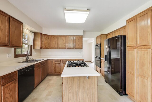 1492 Della Dr, Hoffman Estates, IL 60169 - kitchen with black appliances, a center island, light countertops, and brown cabinetry