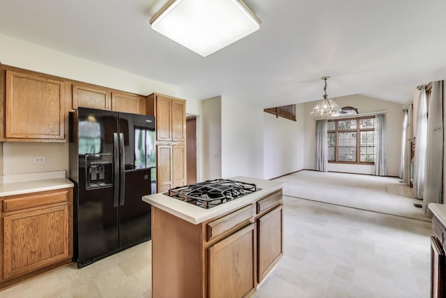 1492 Della Dr, Hoffman Estates, IL 60169 - kitchen featuring black appliances, light countertops, pendant lighting, a kitchen island, and brown cabinetry