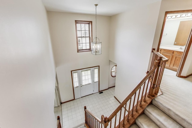 1492 Della Dr, Hoffman Estates, IL 60169 - entrance foyer with a chandelier, a high ceiling, and stairs
