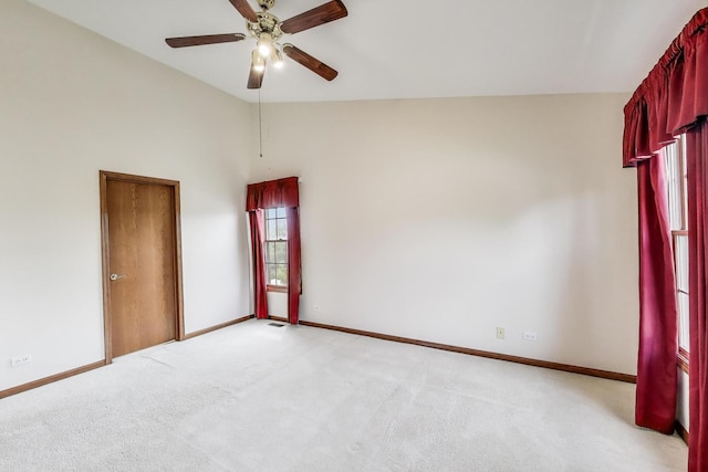 1492 Della Dr, Hoffman Estates, IL 60169 - empty room featuring ceiling fan, vaulted ceiling, and light colored carpet
