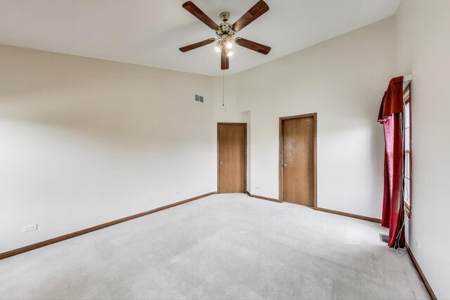 1492 Della Dr, Hoffman Estates, IL 60169 - unfurnished bedroom featuring light colored carpet, ceiling fan, and vaulted ceiling