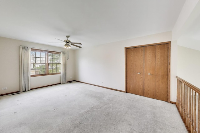 1492 Della Dr, Hoffman Estates, IL 60169 - unfurnished bedroom featuring light colored carpet, a ceiling fan, and a closet