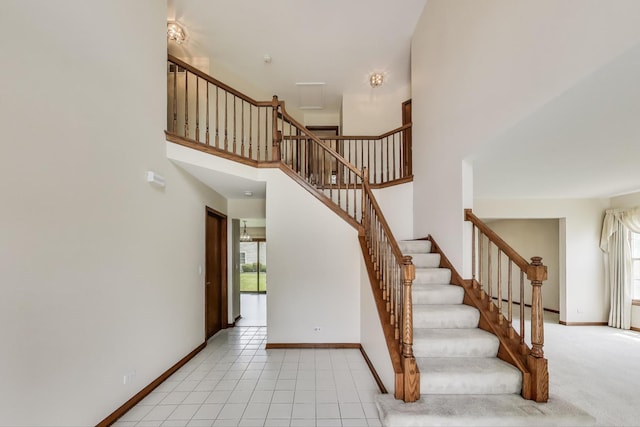 1492 Della Dr, Hoffman Estates, IL 60169 - stairway featuring baseboards and a high ceiling