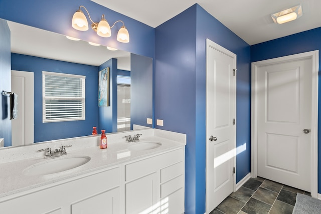 6012 Winterhaven Dr, Joliet, IL 60431 - bathroom featuring double vanity and baseboards