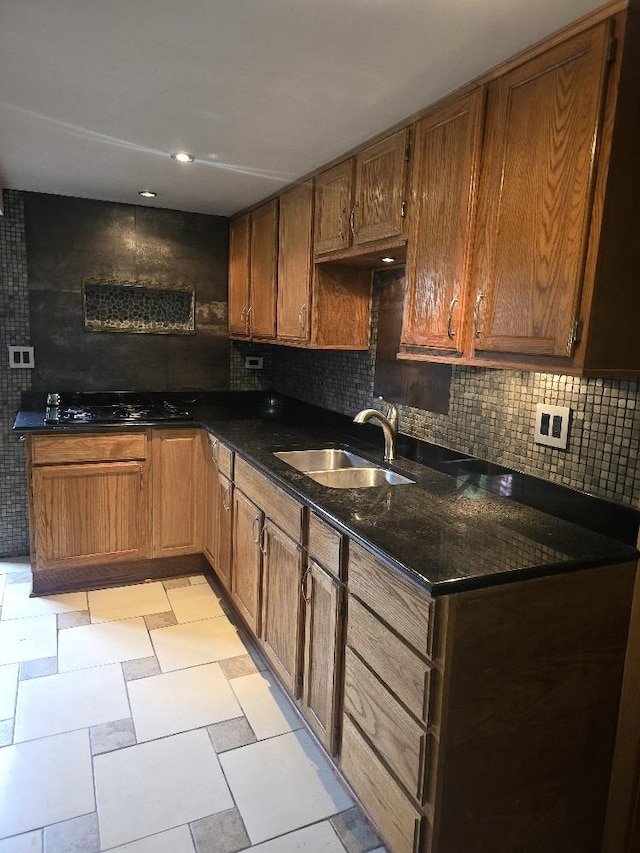3933 N Oak Park Ave, Chicago, IL 60634 - kitchen with a sink, black gas cooktop, decorative backsplash, and light flooring