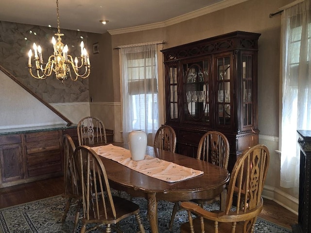 3933 N Oak Park Ave, Chicago, IL 60634 - dining space with a chandelier, plenty of natural light, wood finished floors, and ornamental molding