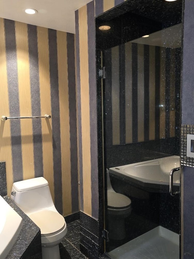 3933 N Oak Park Ave, Chicago, IL 60634 - bathroom with toilet and wallpapered walls