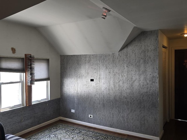 3933 N Oak Park Ave, Chicago, IL 60634 - bonus room featuring lofted ceiling, wood finished floors, and baseboards