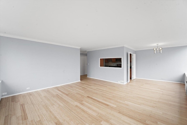 5757 N Sheridan Rd Unit 5J, Chicago, IL 60660 - unfurnished living room with a chandelier, ornamental molding, light wood-style floors, and baseboards