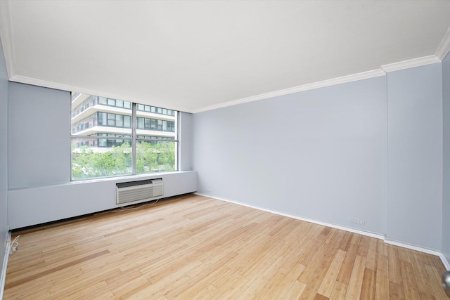 5757 N Sheridan Rd Unit 5J, Chicago, IL 60660 - empty room featuring wood finished floors, crown molding, baseboards, and a wall unit AC