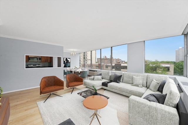 5757 N Sheridan Rd Unit 5J, Chicago, IL 60660 - living area featuring light wood-style floors, a chandelier, baseboards, and crown molding