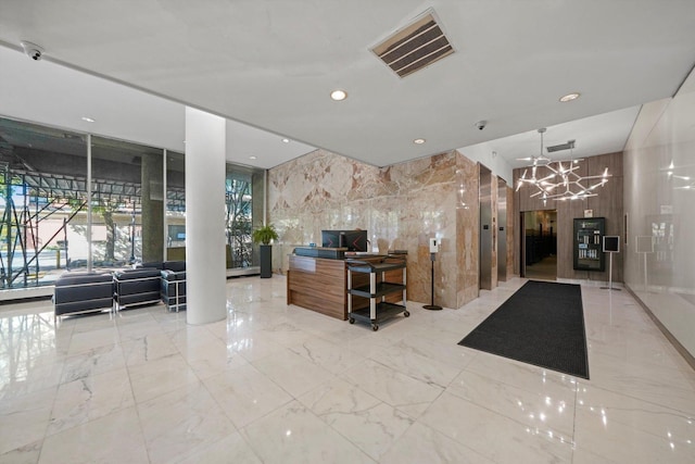5757 N Sheridan Rd Unit 5J, Chicago, IL 60660 - community lobby with recessed lighting, a surveillance system, and expansive windows