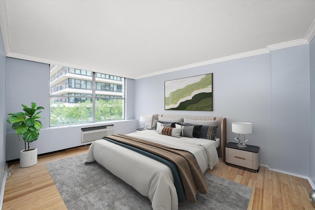 5757 N Sheridan Rd Unit 5J, Chicago, IL 60660 - bedroom featuring wood finished floors, crown molding, and a wall mounted AC