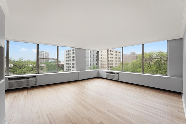 5757 N Sheridan Rd Unit 5J, Chicago, IL 60660 - unfurnished sunroom featuring a city view and a wall mounted air conditioner