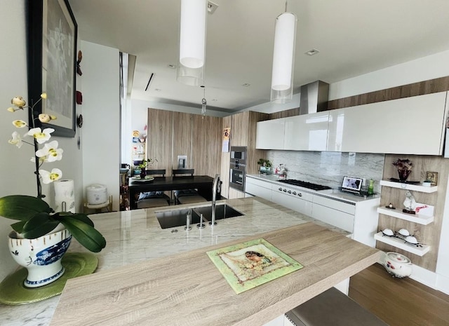363 E Wacker Dr Unit 4801, Chicago, IL 60601 - kitchen with a sink, white gas cooktop, backsplash, wood finished floors, and white cabinetry