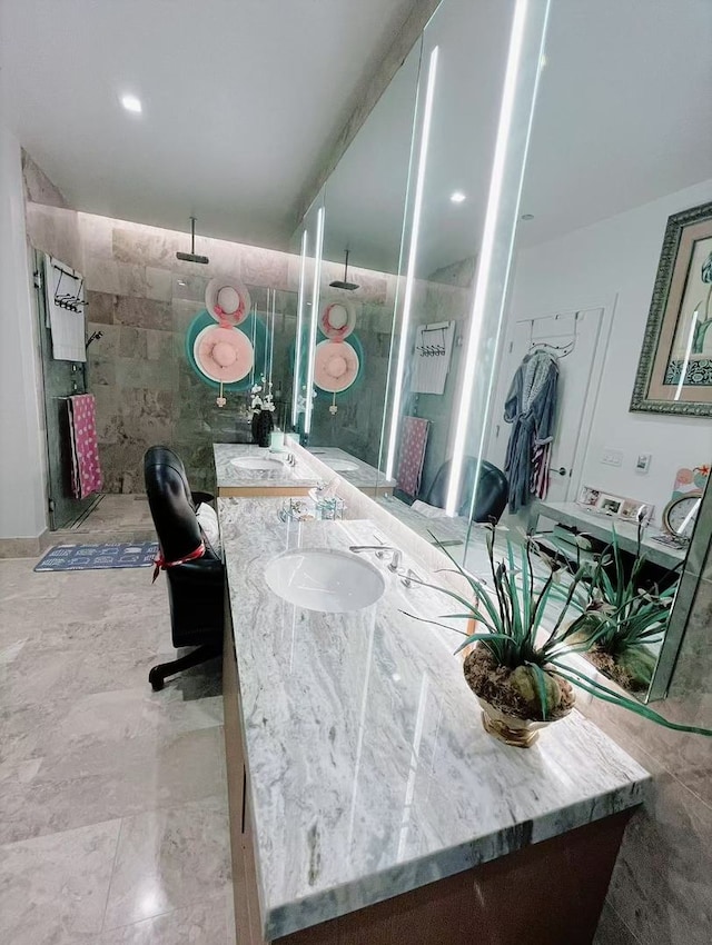 363 E Wacker Dr Unit 4801, Chicago, IL 60601 - bathroom featuring double vanity, tiled shower, and tile walls