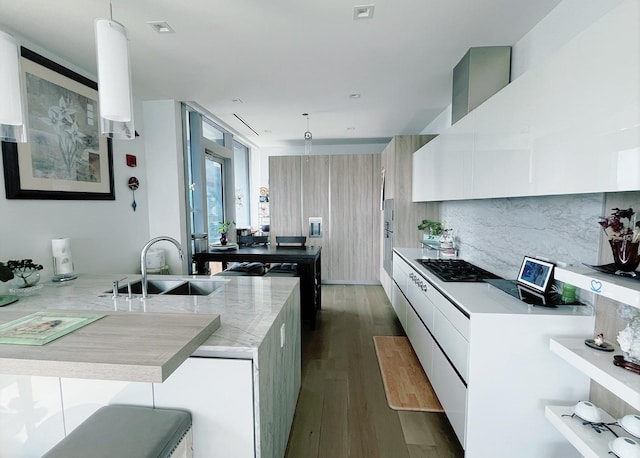 363 E Wacker Dr Unit 4801, Chicago, IL 60601 - kitchen with a sink, black gas stovetop, dark wood-style flooring, decorative backsplash, and modern cabinets