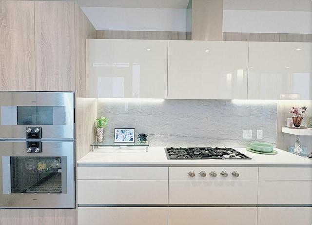 363 E Wacker Dr Unit 4801, Chicago, IL 60601 - kitchen featuring appliances with stainless steel finishes, modern cabinets, light countertops, and white cabinets