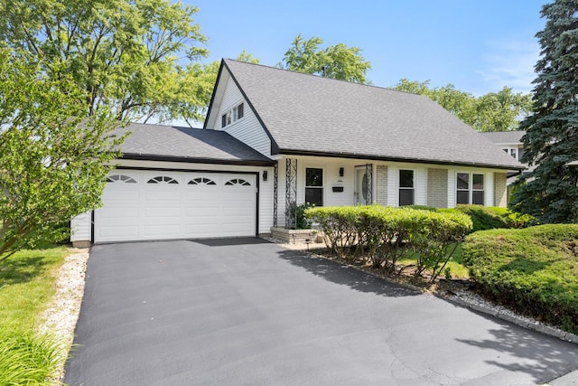 326 Dorchester Ln, Elk Grove Village, IL 60007 - view of front of house with an attached garage, driveway, and roof with shingles