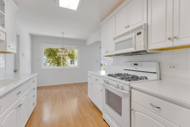326 Dorchester Ln, Elk Grove Village, IL 60007 - kitchen featuring white appliances, tasteful backsplash, light countertops, and light wood finished floors