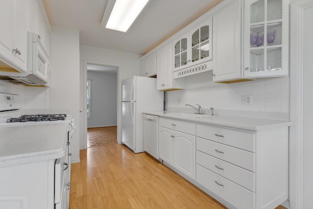 326 Dorchester Ln, Elk Grove Village, IL 60007 - kitchen with white appliances, decorative backsplash, white cabinets, light wood-type flooring, and glass insert cabinets