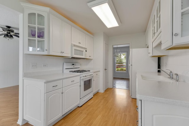 326 Dorchester Ln, Elk Grove Village, IL 60007 - kitchen featuring white appliances, tasteful backsplash, light wood finished floors, and white cabinets