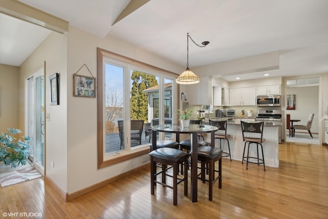 2212 High Point Dr, Lindenhurst, IL 60046 - dining space with light wood-style floors, baseboards, and recessed lighting