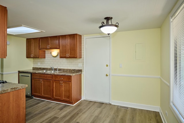 6256 Kit Carson Dr Unit 6256, Hanover Park, IL 60133 - kitchen with a sink, dishwasher, dark wood-style flooring, and tasteful backsplash