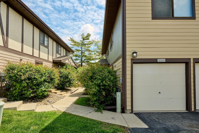 6256 Kit Carson Dr Unit 6256, Hanover Park, IL 60133 - view of property exterior featuring a garage
