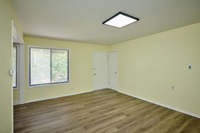 6256 Kit Carson Dr Unit 6256, Hanover Park, IL 60133 - unfurnished room featuring wood finished floors and baseboards