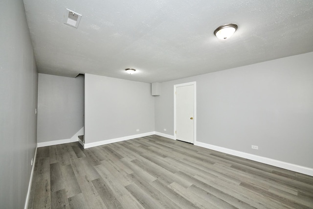 6256 Kit Carson Dr Unit 6256, Hanover Park, IL 60133 - below grade area featuring wood finished floors and baseboards